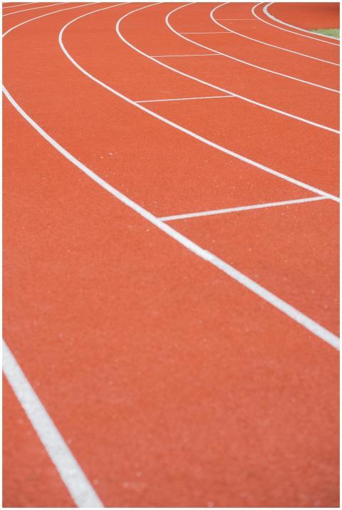 Close-up view of an athletic running track with cu