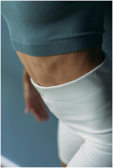 Close-up shot of a fit woman highlighting strong a