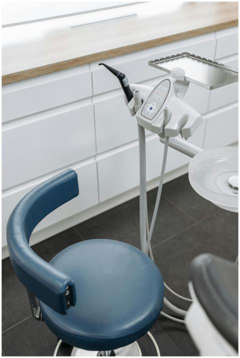 High-angle view of dental chair and equipment in a
