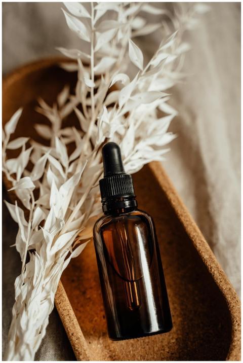 Aesthetic shot of a brown glass dropper bottle wit