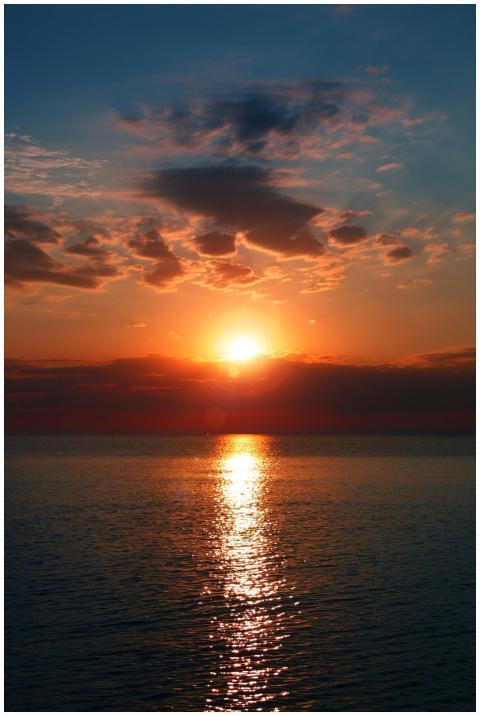 Breathtaking sunset over a calm ocean with vibrant