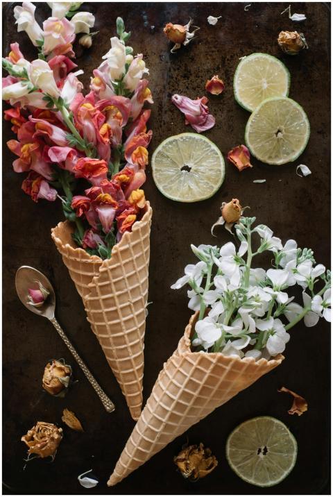 Flowers in waffle cones with citrus slices create