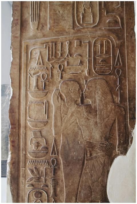 Detailed stone carving depicting ancient Egyptian