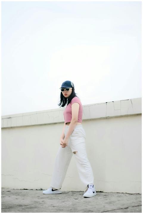 Fashionable woman wearing a crop top and white pan