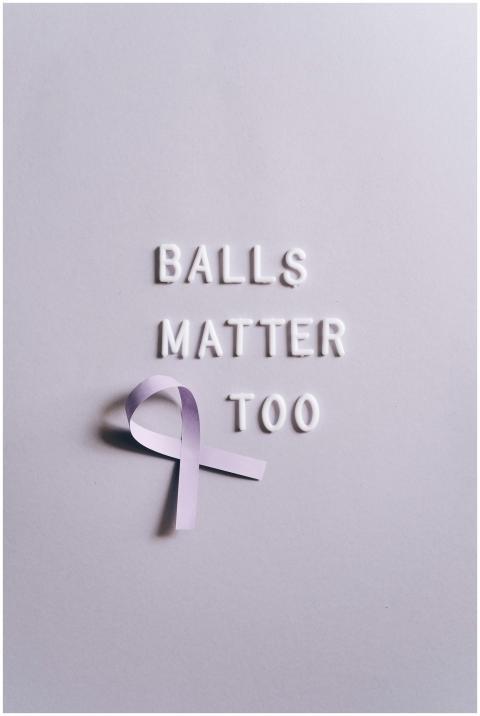 Purple ribbon with 'Balls Matter Too' text promoti