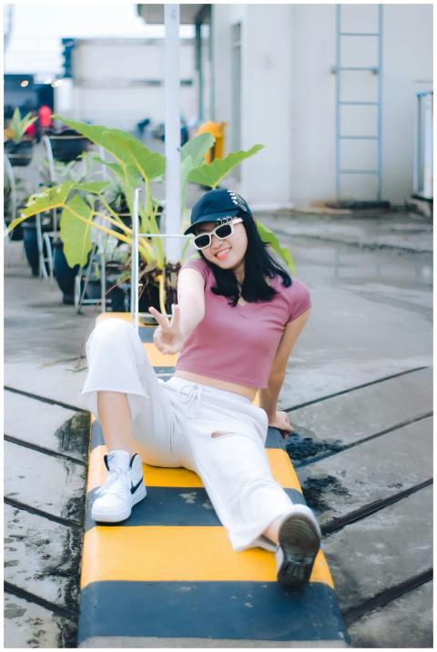 Casual fashion shot of a young woman posing outdoo