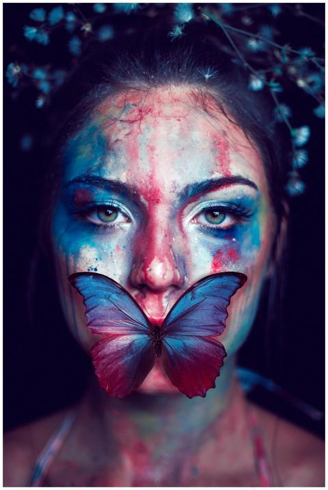 A vibrant artistic portrait featuring a woman with