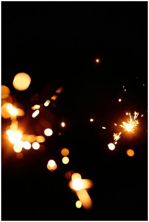 Abstract image of sparkles with dark background, s