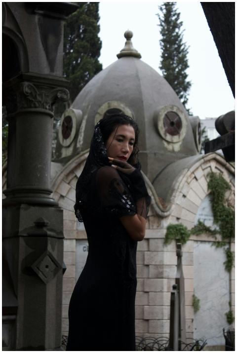 Mystical scene of a woman in a gothic cemetery, co