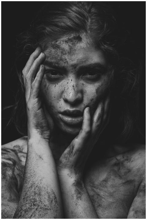 Dramatic black and white portrait of a woman with