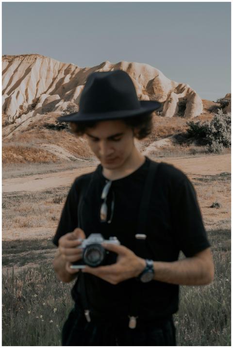 A young man with a camera in Cappadocia, Türkiye,