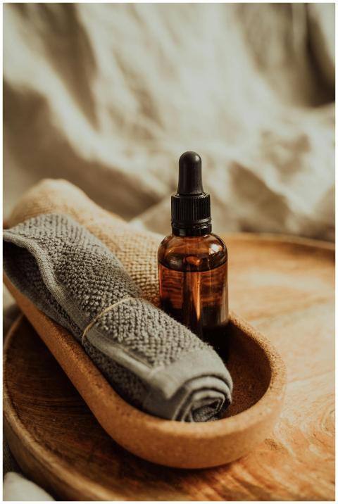 Close-up of a glass amber bottle with massage oil