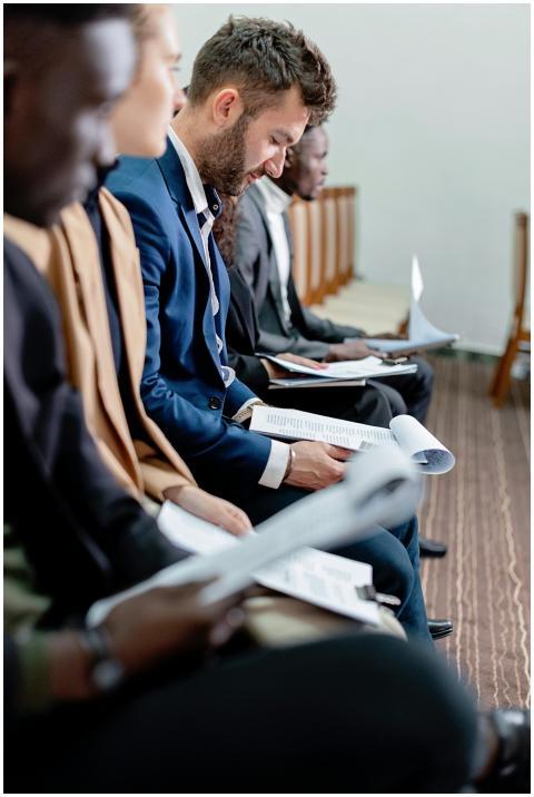 Business professionals in a corporate meeting revi