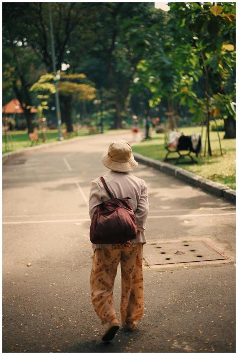 Elderly Woman Strolling Sunny
