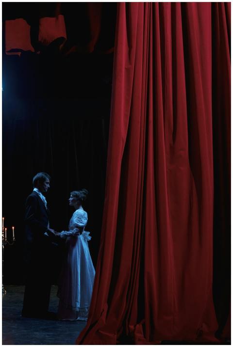 A captivating stage scene featuring a man and woma