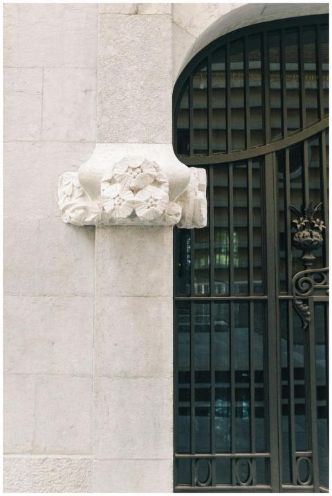 Intricate bas relief and metal gate on a Spanish-s