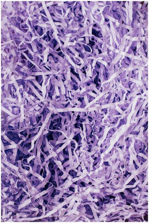 Close-up of purple shredded paper creating a textu