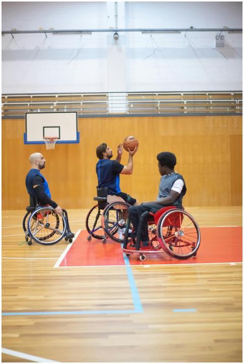 Energetic wheelchair basketball players engage in