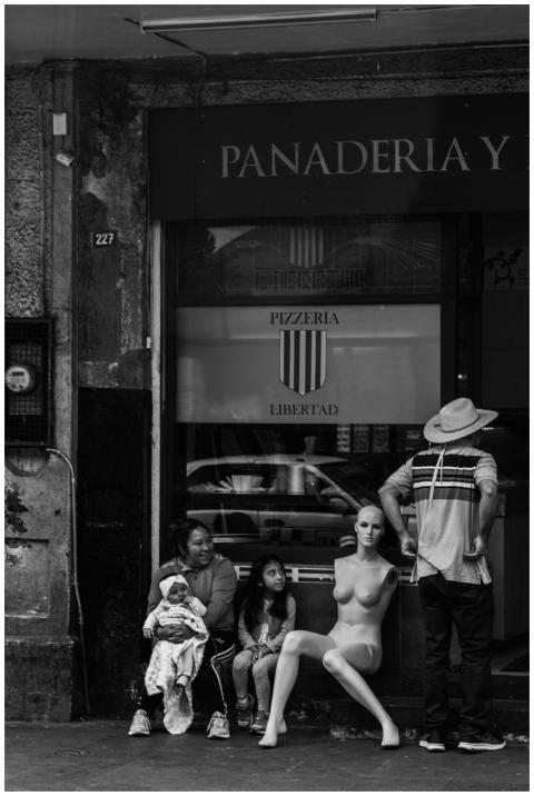 Black and white photo of an urban scene featuring