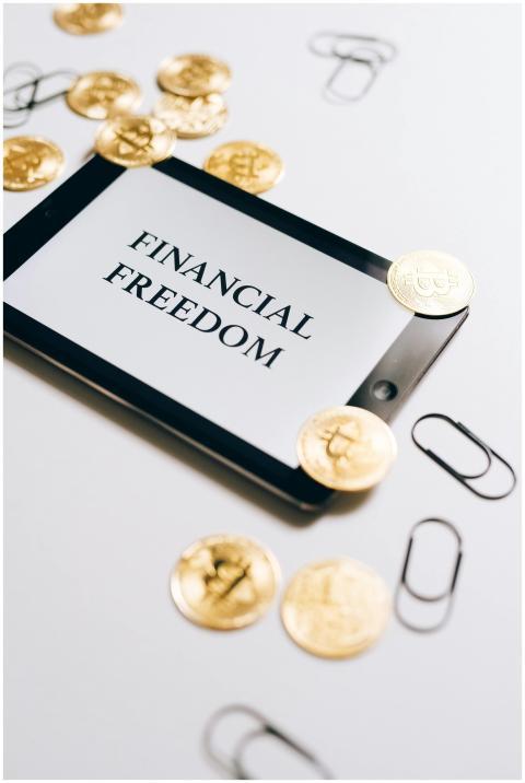 Coins are scattered around a digital tablet displa