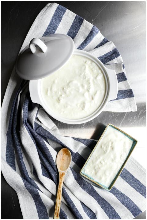 Top view of homemade yogurt in a ceramic pot, styl