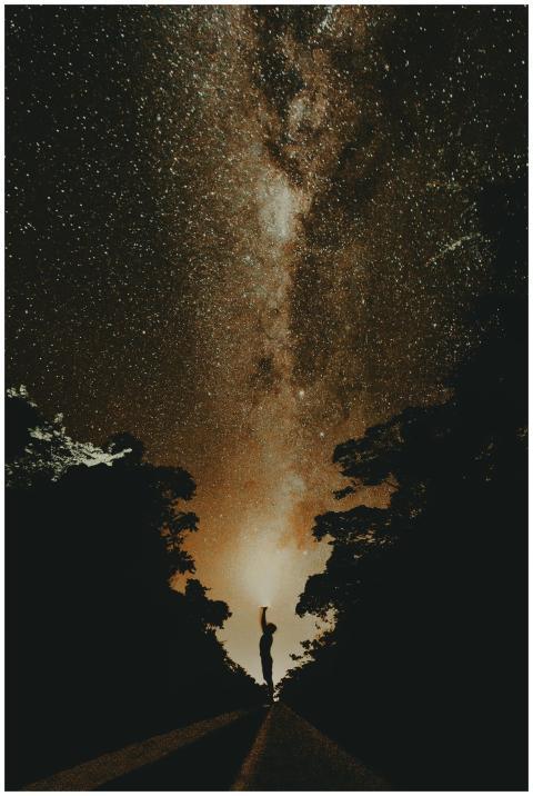 Captivating silhouette against the Milky Way's bri