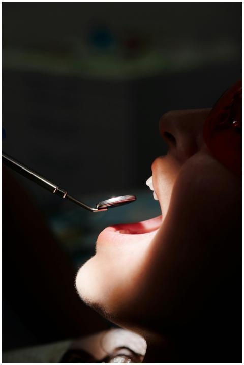 A close-up view of a dental inspection with mouth