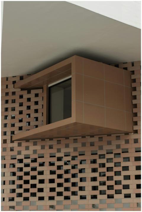 Contemporary window design within a unique brick f