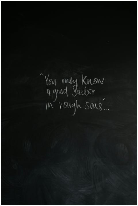 Inspirational message about sailors on a chalkboar