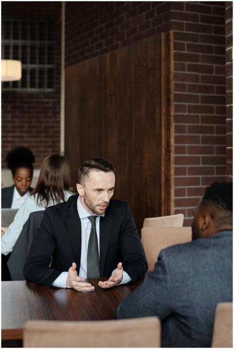 Professionals in suits having a focused business d