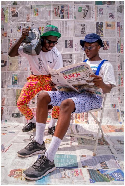 Two stylish men in Nigeria enjoying a sunny day wi