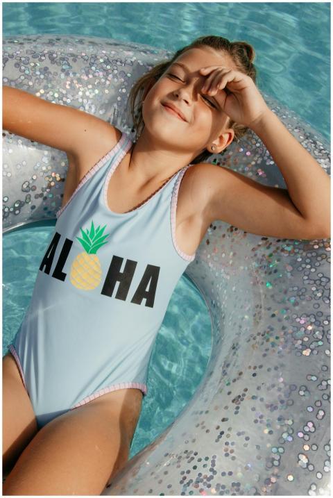 Young girl enjoying summer on a float in the pool,