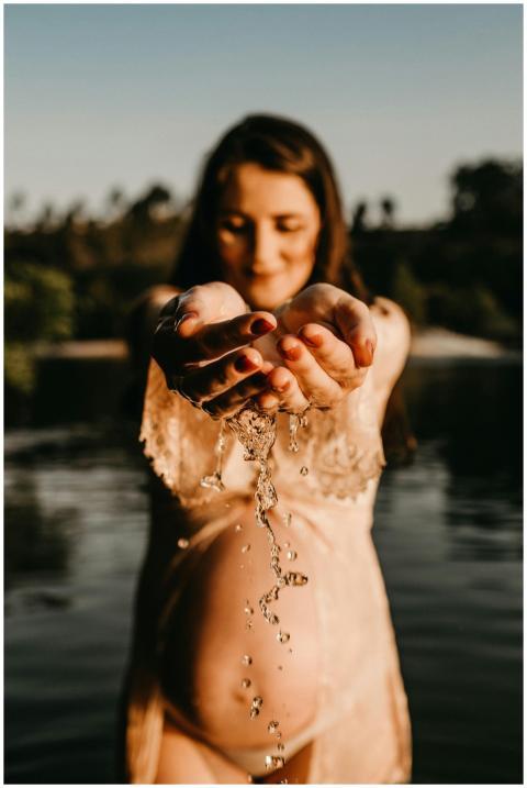A serene portrait of a pregnant woman enjoying nat