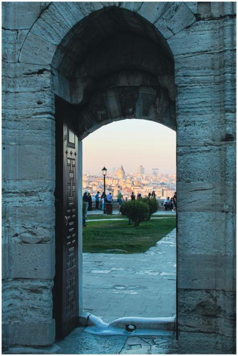 View of İstanbul through a historic archway with p
