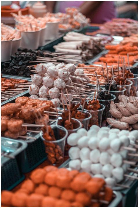 A vibrant display of diverse skewered street foods