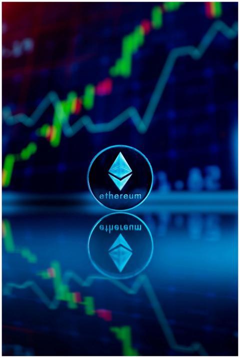 Ethereum coin reflecting with financial graph in t