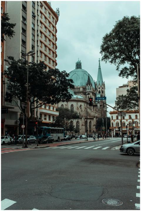 A bustling urban cityscape featuring a gothic-styl