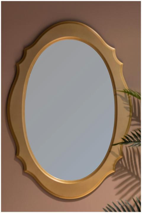 Oval mirror with golden frame reflecting elegant m