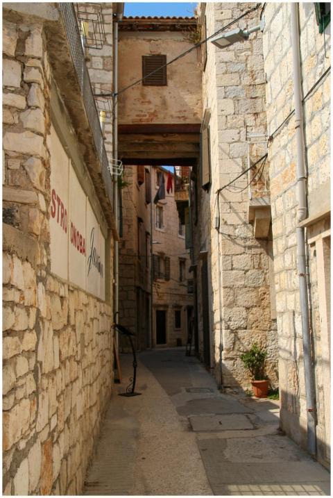 Explore a picturesque narrow alley lined with rust