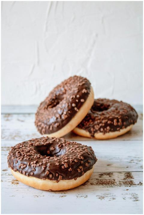Close-up of chocolate glazed donuts with sprinkles