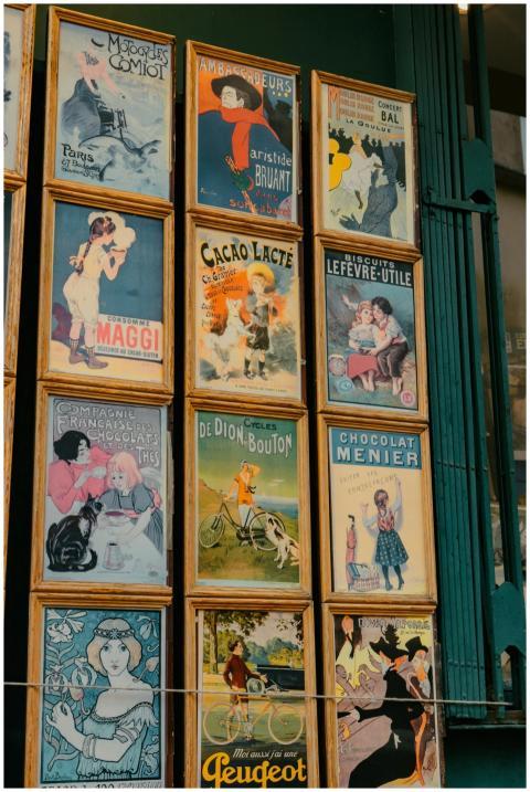 Vintage French posters displayed on a wall in Pari