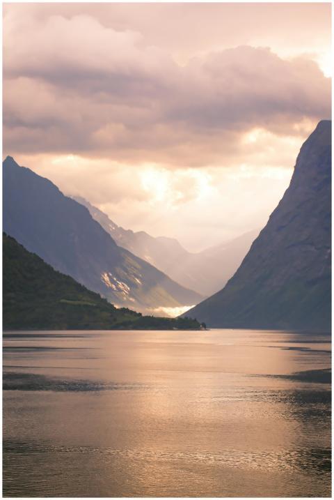Captivating view of a Norwegian fjord under dramat