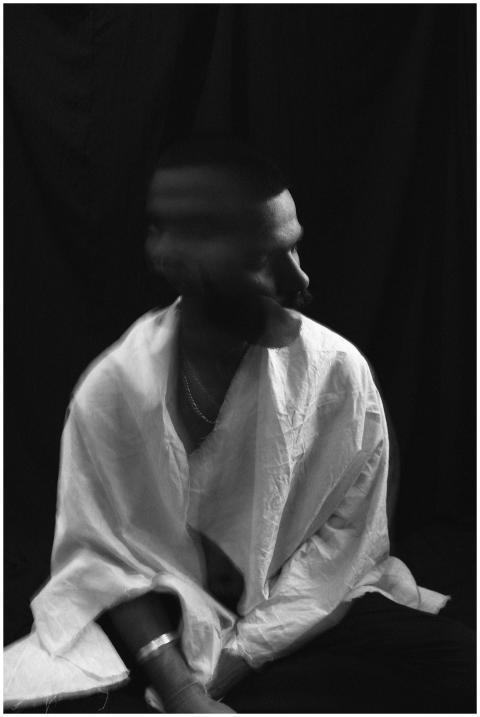 Black and white of lonely melancholic male in whit