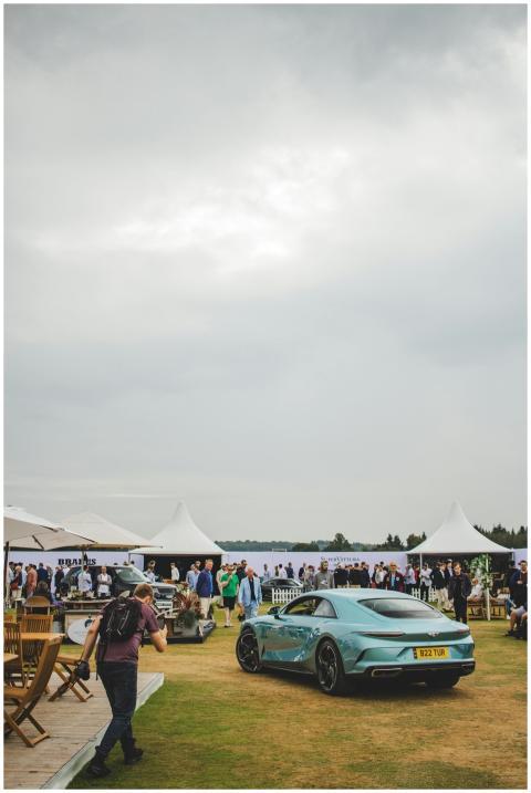 A luxury car displayed at an outdoor event with a