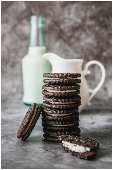 Delicious stack of chocolate cookies and milk bott