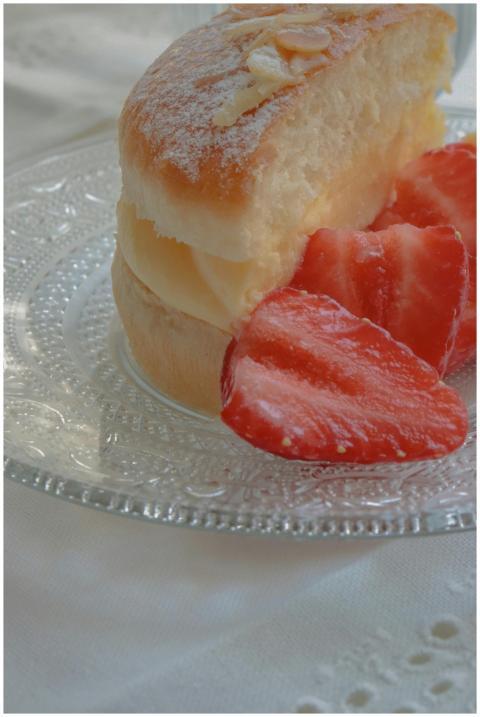 Aesthetic dessert with cream and strawberries on a