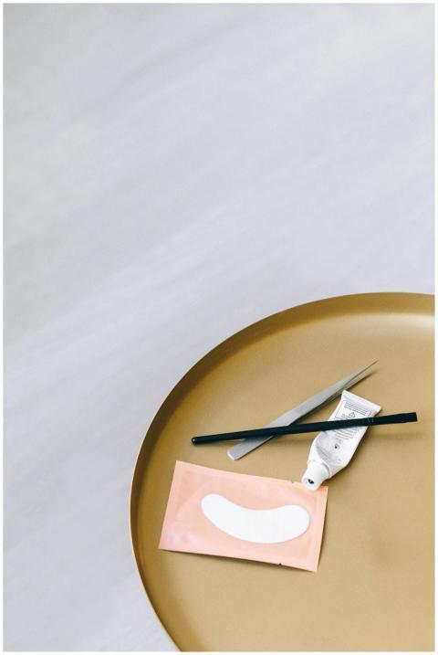 Minimalist flat lay of skincare tools and eye mask