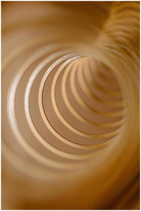Close-up abstract image of golden spirals creating