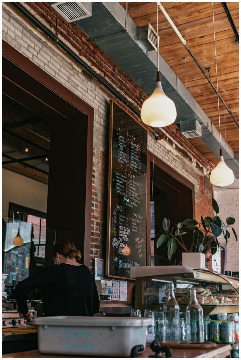 A rustic café setting with a detailed menu board a