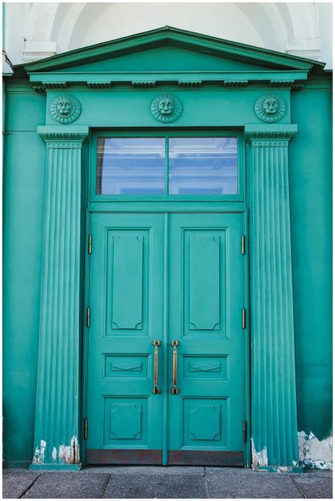 Majestic teal entrance door with classical details